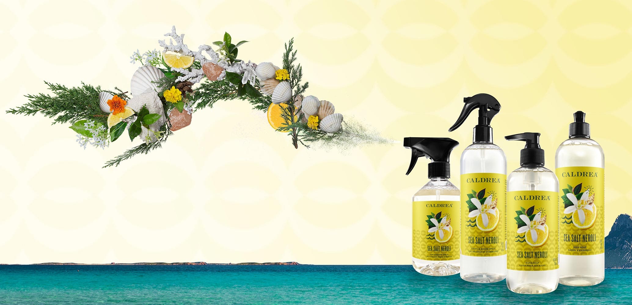 A collection of countertop spray, dish soap, and more spray out elements that encompass our scent: Sea Salt Neroli.
