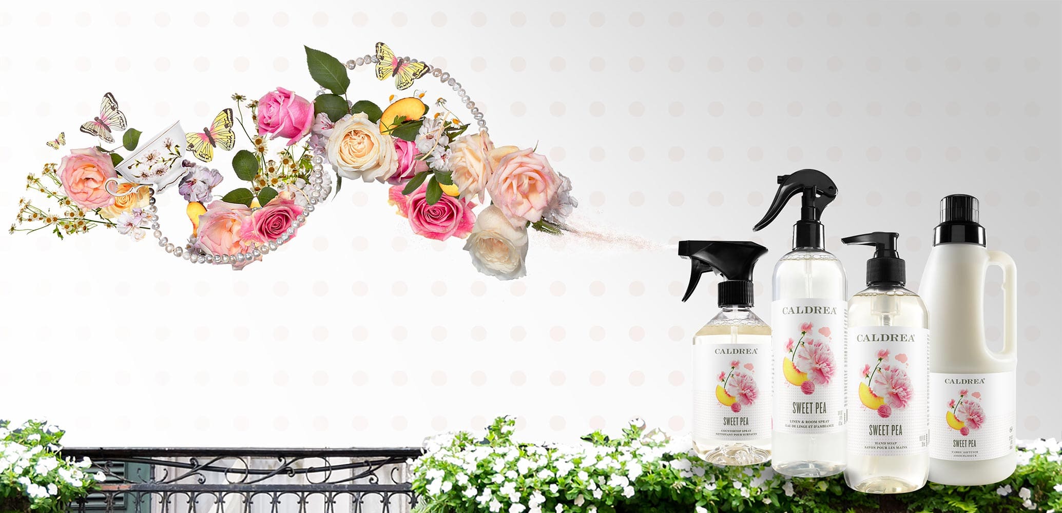 A collection of countertop spray, dish soap, and more spray out elements that encompass our scent: Sweet Pea.